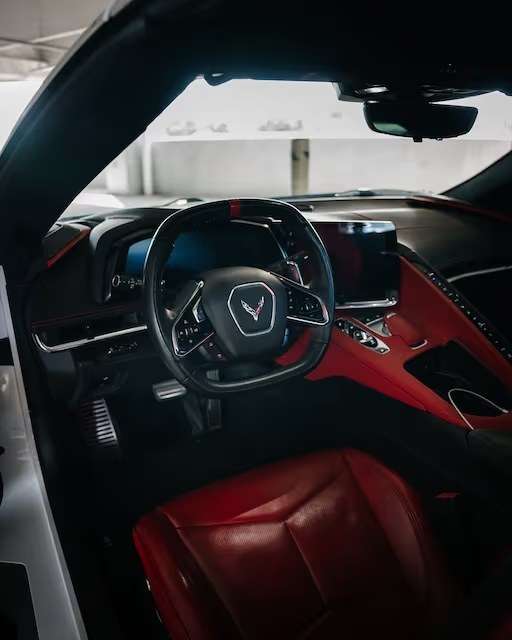 Chevrolet Corvette C8 cockpit in red leather with the squared steering wheel