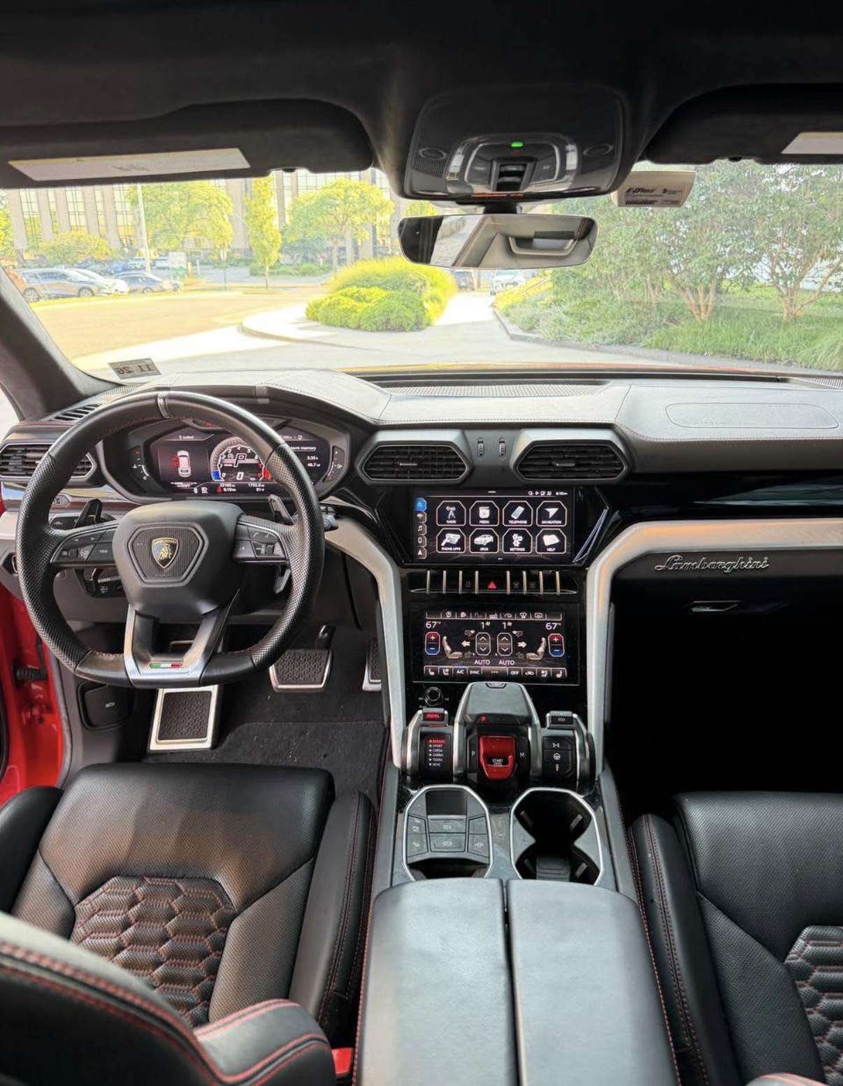 Lamborghini Urus cockpit, black leather with red stitching
