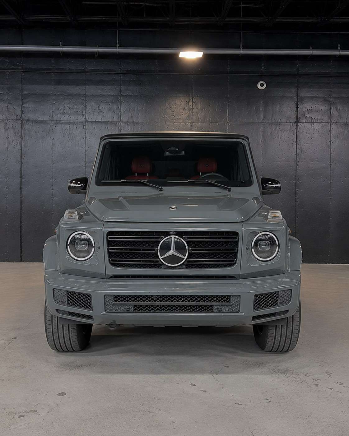 Grey Mercedes G63, straight front in the studio