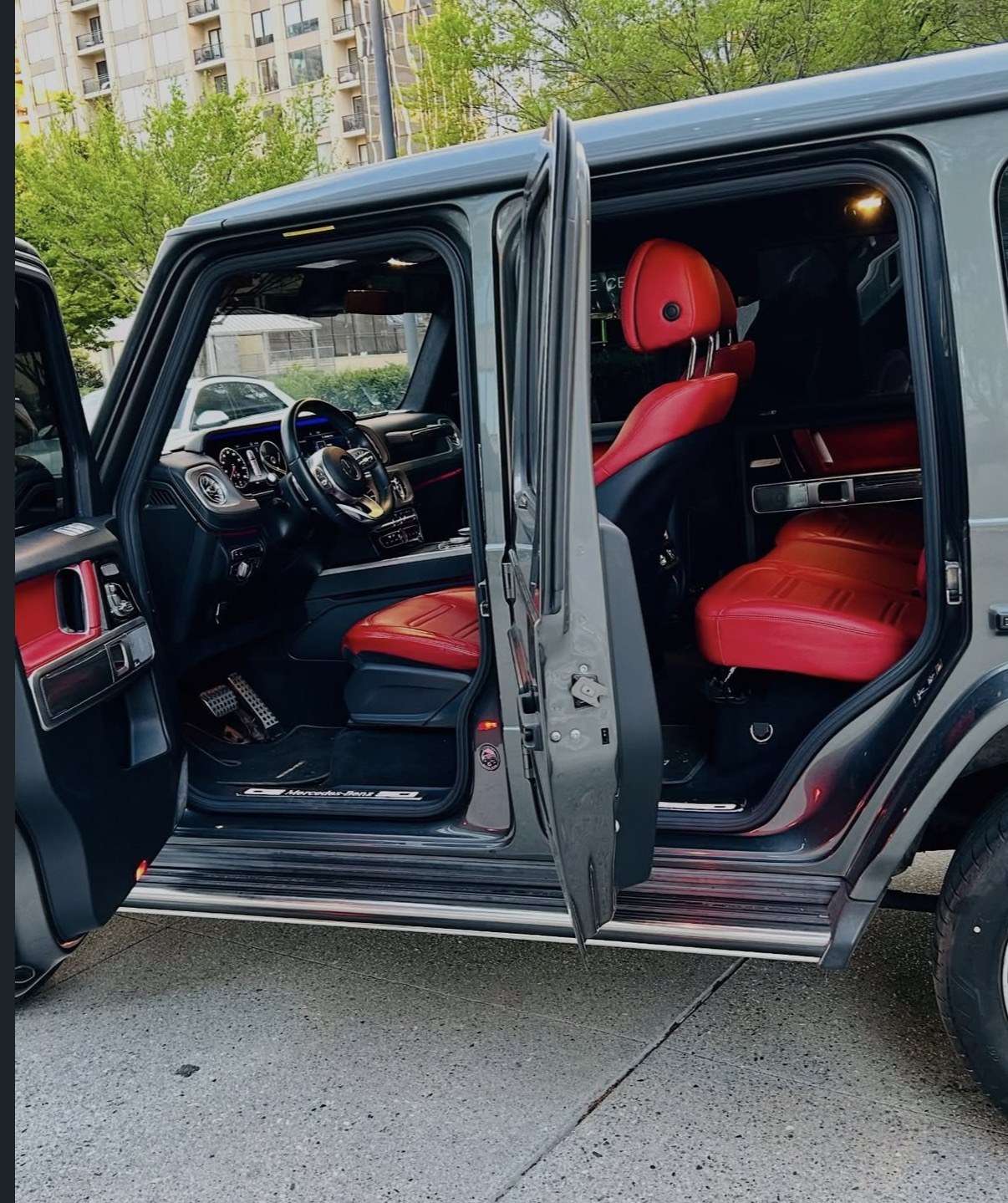 Mercedes G63 with doors open showing the red leather cabin