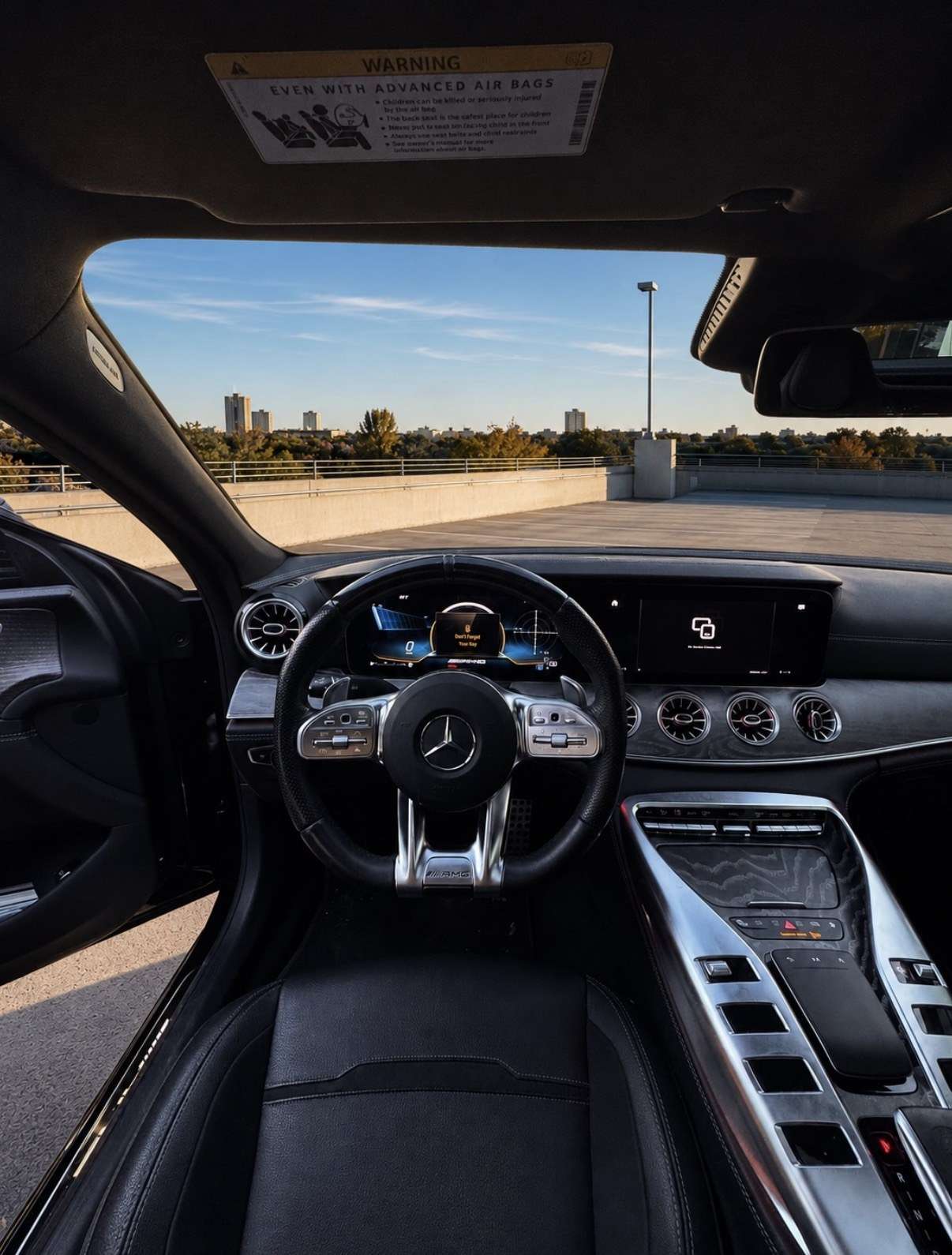 Mercedes-AMG GT 43 cockpit in black leather with the AMG wheel and twin screens