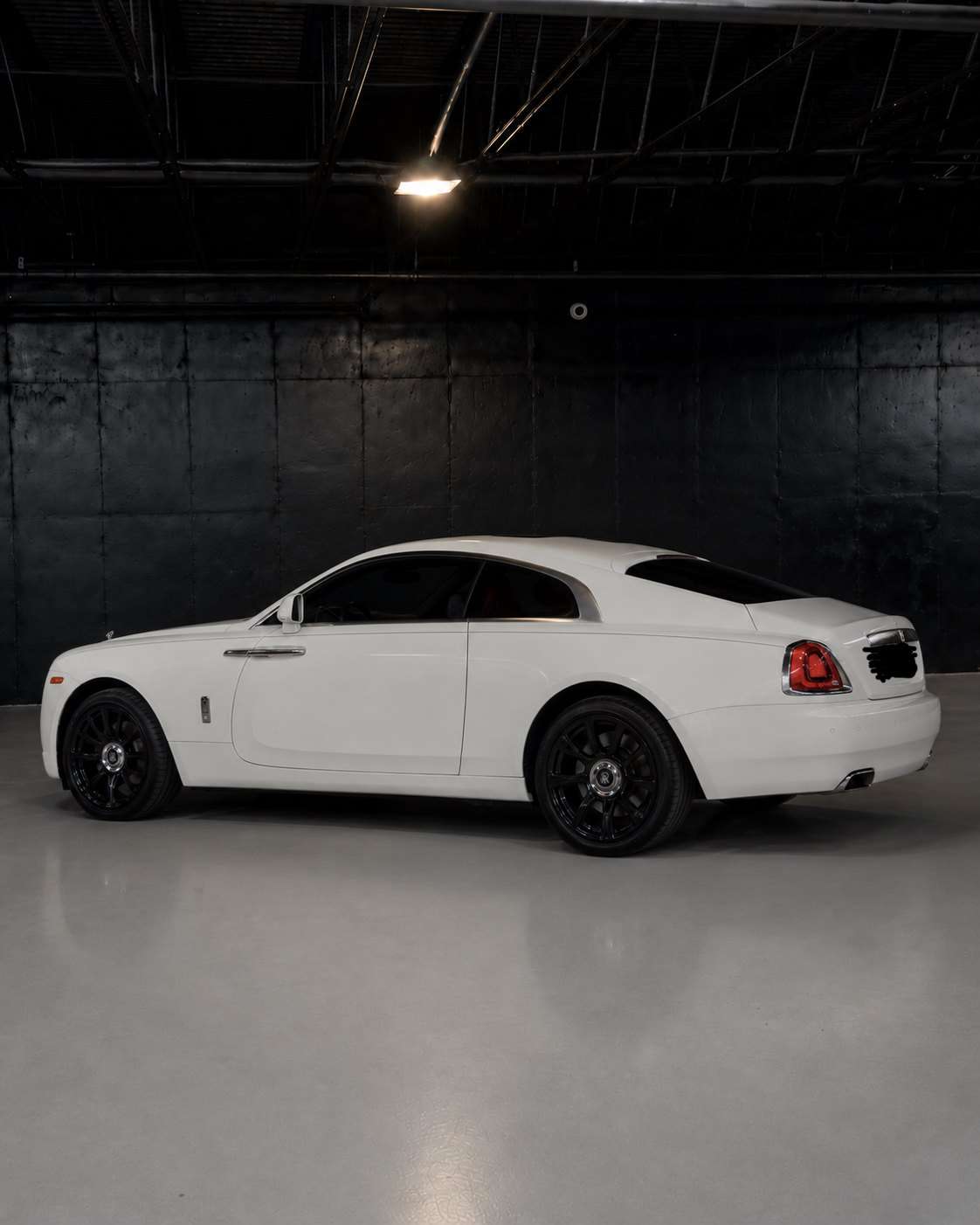White Rolls-Royce Wraith, rear three quarter in the studio