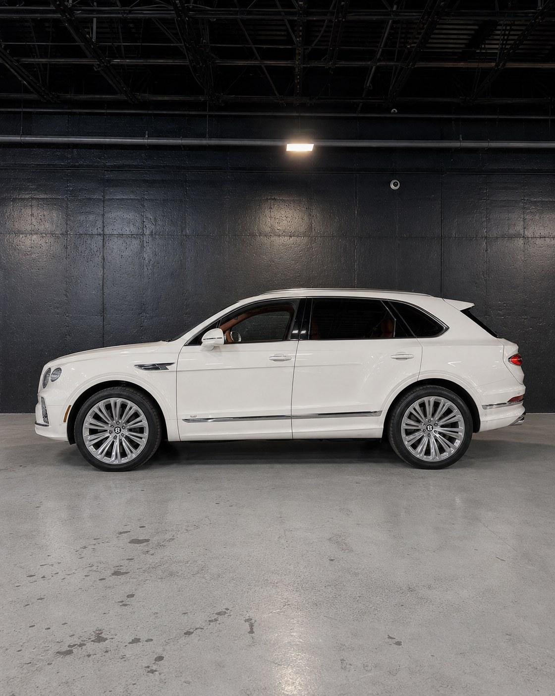 White Bentley Bentayga, side profile in the studio