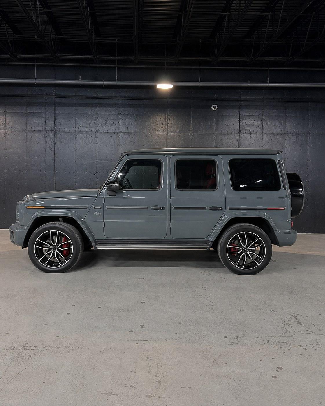 Grey Mercedes-AMG G63, side profile in the studio