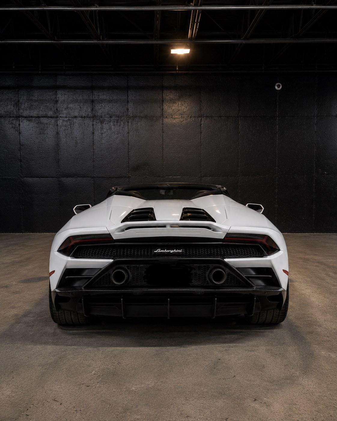 Lamborghini Huracan EVO Spyder, straight rear with quad exhausts in the studio