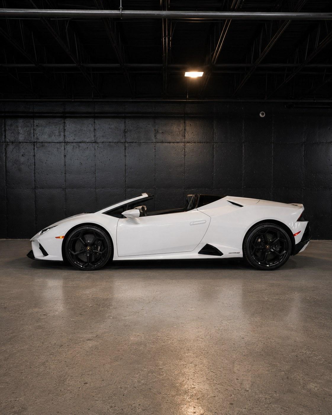 White Lamborghini Huracan EVO Spyder, top down, side profile in the studio